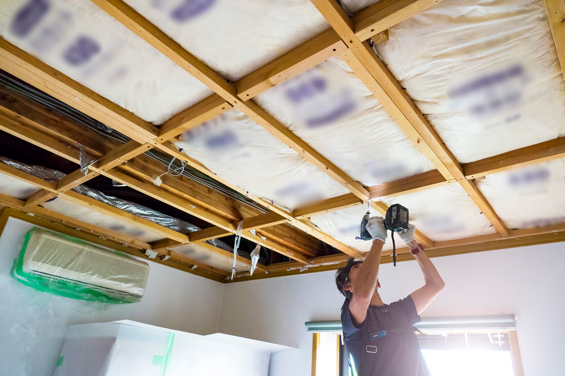 A restoration contractor working inside a home