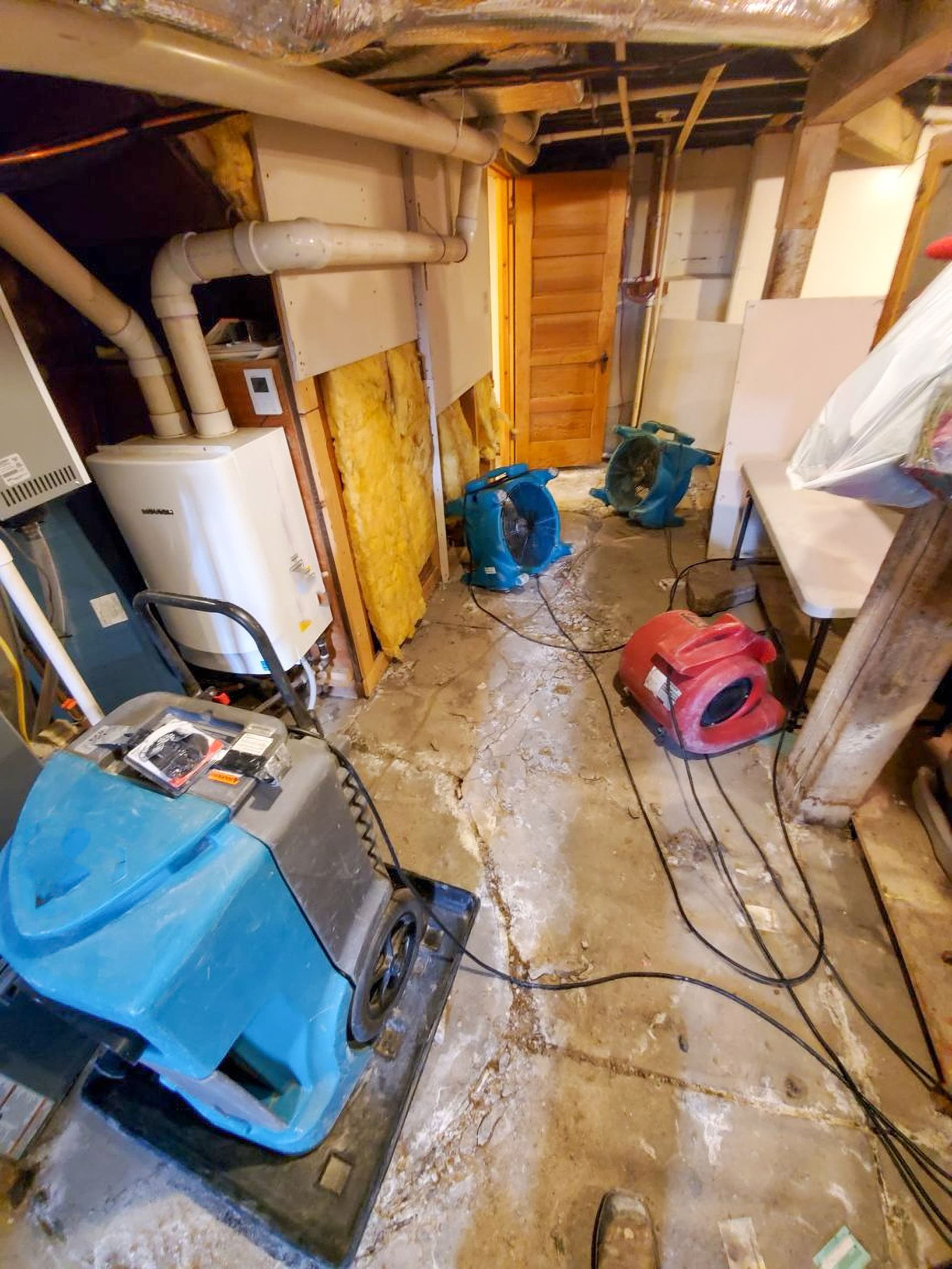 Air movers drying a flooded basement during mitigation